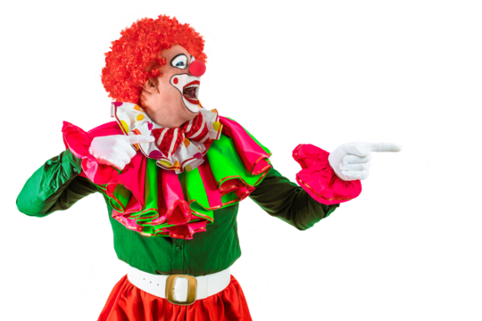 Funny clown pointing at blank template copy spase for advertising, posters, greetings, invitations. Entertainer as Joker in a suit and wig, with clown whiteface makeup.