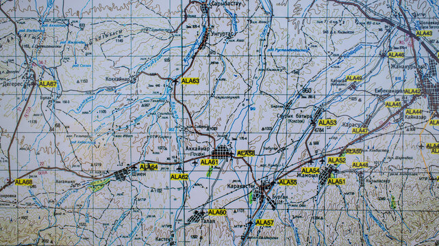 Topographic map with geographical coordinates, roads, terrain contours and marked locations
