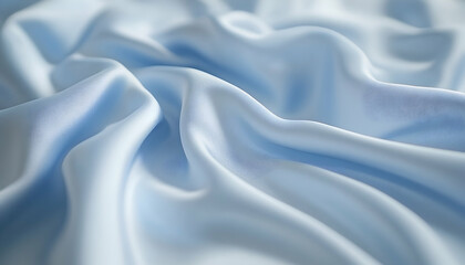 Obraz premium Soft, flowing light blue fabric draped elegantly, creating gentle waves and shadows in a serene atmosphere