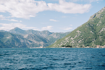 St. George Island in the Bay of Kotor against the backdrop of a high mountain range. Montenegro