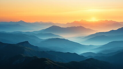 Obraz premium Sunrise paints a majestic panorama of layered mountain ranges.