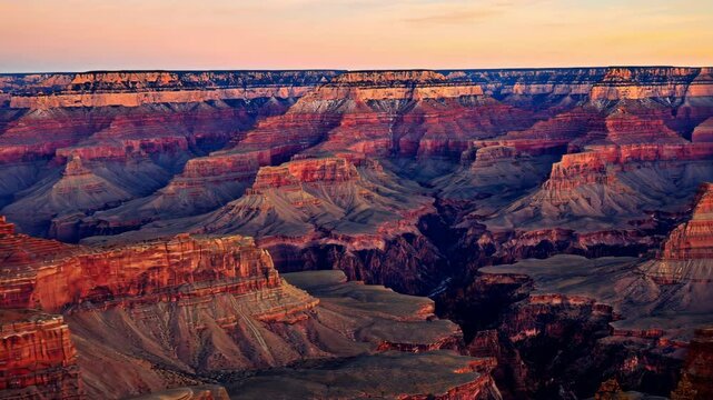 Layers of Rock: An Aerial View of a Canyon Under a Colorful Sky during Sunset
