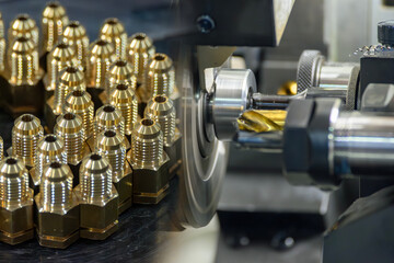 Abstract scene the multi tasking CNC lathe machine and the group of brass male fitting connector...