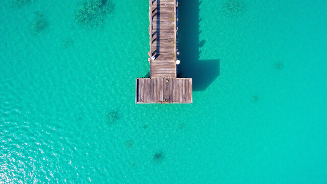 Aerial View of Wooden Pier on Turquoise Water