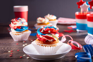 Independence Day Fourth of July USA American patriotic party with american symbols. Cupcakes dessert decorated cream cheese or buttercream.