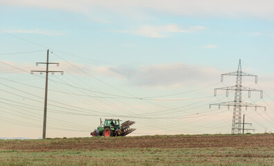 Tractor working the agricultural fields outside of Stuttgart city, Germany