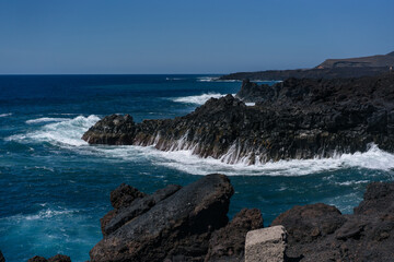 waves breaking on the rocks