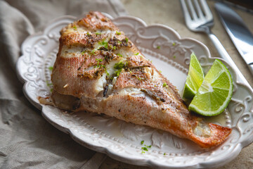 Baked sea bass with herbs and lime