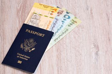 Fototapeta premium American passport with Yemeni money