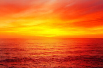 Fototapeta premium Vibrant sunset over the calm ocean, with hues of orange and yellow blending into the horizon