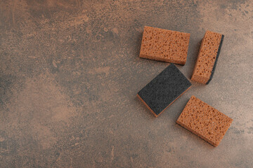 Set of sponges for washing dishes. Organic cleaning concept, coffee aroma. Zero waste style