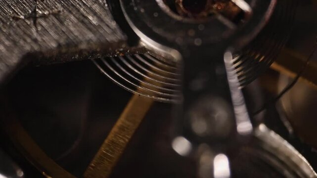 Movement of the mainspring in a clock mechanism close-up mechanical parts of a clock