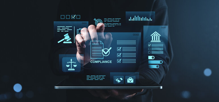 Businessman interacting with compliance and legal digital interface icons on creative futuristic screen background using a tablet device in dark blue tone.