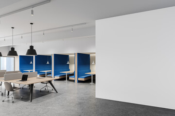 Modern office interior with bright empty white wall for poster mockup or creative design display template in stylish collaborative workspace. 3D Rendering