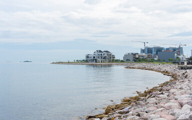 Coastal Property and Cityscape View Under Cloudy Sky by the Sea