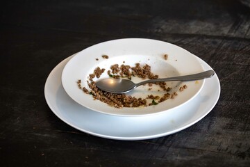 Traditional dish with ground beef and vegetables on an old plate and rustic surface, real food. Brazilian food