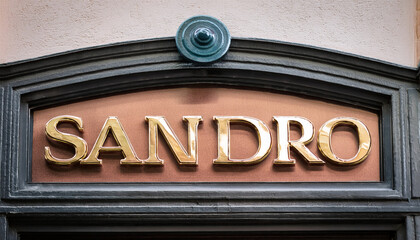 Obraz premium sandro sign text shop and logo brand store chain on wall facade entrance on fashion clothing