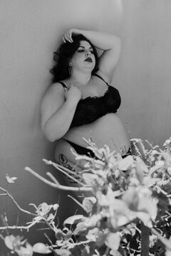 Plus size old Hollywood lingerie model outdoors
