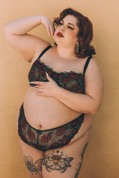 Plus size old Hollywood lingerie model outdoors