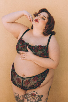 Plus size old Hollywood lingerie model outdoors