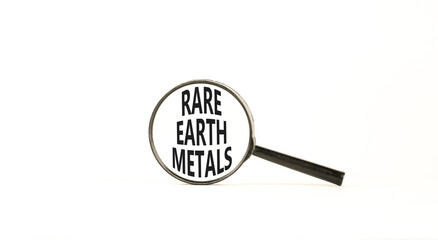 Rare earth metals symbol. Concept words Rare earth metals in beautiful magnifying glass. Beautiful...