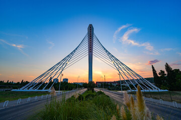 Fototapeta premium Millenium Bridge (Most Milenijum), a cable-stayed bridge that spans the Moraca river in Podgorica, the capital city of Montenegro in the Balkans