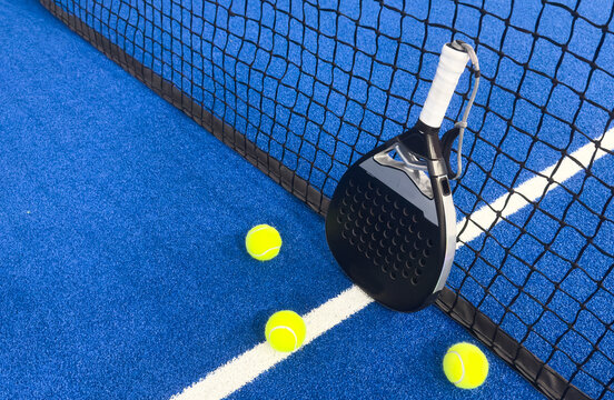 padel tennis racket sport court and balls.