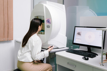 Perimetry eyes test for early sign of glaucoma of woman patient of ophthalmology clinic. Perimetry...