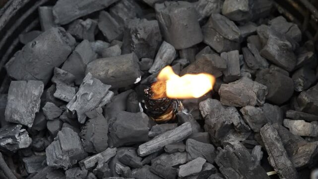 firestarter burning in grill coals