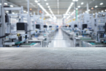 Steel tabletop with scratches and blur background of factory or warehouse. Business presentation....