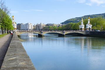 The city of Donostia-San Sebastián is reflected in the Urumea river, Euskadi