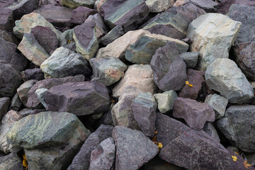 Textured background of large rocks and granite stones 