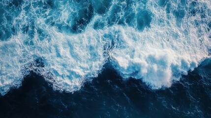 Spectacular aerial top view background photo of ocean sea water white wave splashing in the deep sea. Drone photo backdrop of sea wave in bird eye waves.