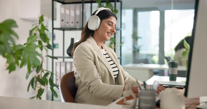 Headphones, computer and businesswoman dancing in office for listening to music with creative project. Technology, audio tech and critic editor with energy for online streaming with album for review.