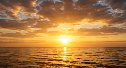 Obraz premium Stunning coastal sunset with glowing clouds and vivid ocean reflections — perfect for travel, nature, relaxation, and inspirational visuals in both print and digital use.