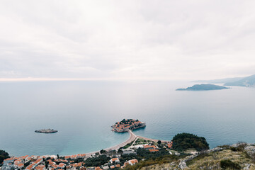 Island of Sveti Stefan in the Bay of Kotor, connected by an isthmus to the mainland. Top view....