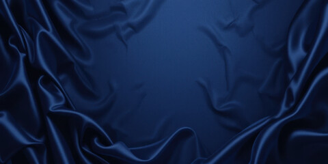 Luxurious dark blue satin fabric with elegant folds and smooth texture creates rich backdrop