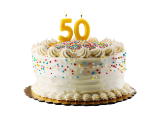 Celebration of a milestone with a beautifully decorated cake featuring bright sprinkles and a prominent 50th birthday candle