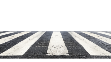 Crosswalk on a city street showing worn black and white lines leading to an empty area