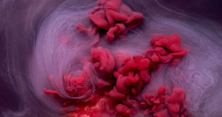 Glitter mist. Sparkle background. Defocused purple red color shiny chemical particles ink smoke...