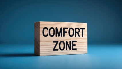 Message about comfort zone on a wooden block with a background.