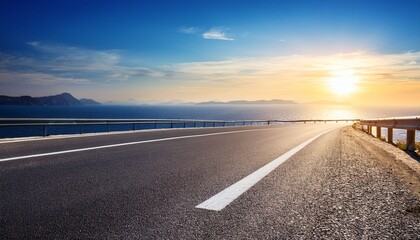 Fototapeta premium Empty asphalt road and blue sea nature landscape at sunset