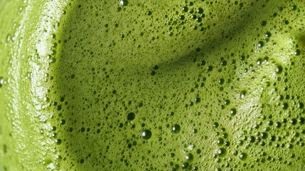 Green milkshake close-up texture. Food background