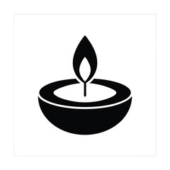 Diwali Lamp burning candle on a black background