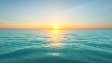 Obraz premium Sun rising or setting over a calm sea with a clear sky.