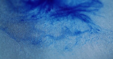 Marble texture. Defocused sky. Bright beautiful blinking blue colorful paint fluid motion on...