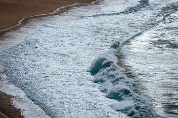 waves on the beach of nazare