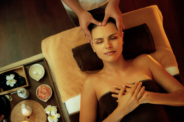 Caucasian woman enjoying relaxing anti-stress head massage and pampering facial beauty skin...