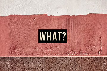 Textured wall with white and terracotta sections, featuring the word "WHAT?" in a black box, creating a question-provoking, intriguing visual, suitable for blog posts or articles