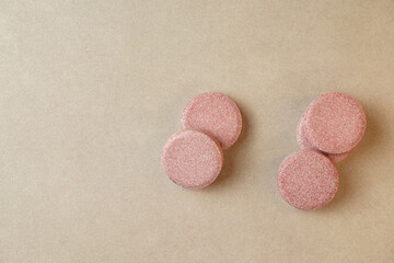 Colorful round tablets arranged artistically on a smooth surface